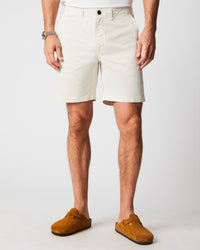 Male model wears the Chino Short in Eggshell