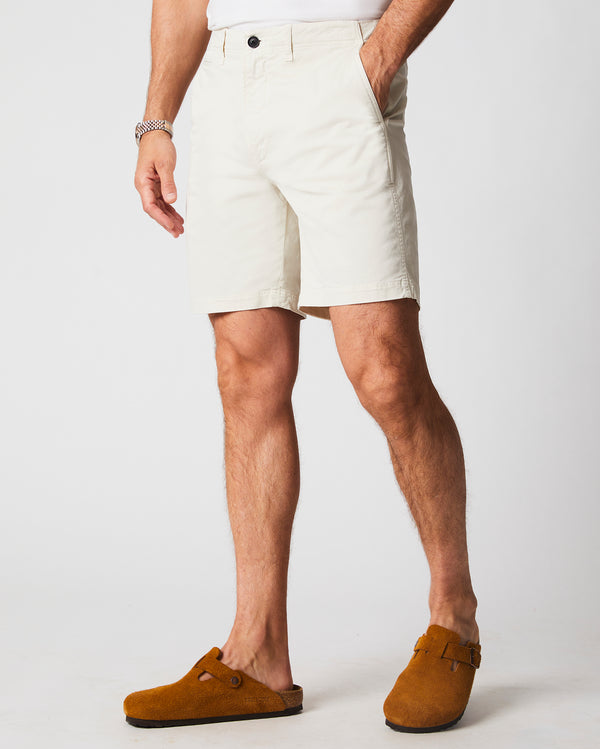 Male model wears the Chino Short in Eggshell