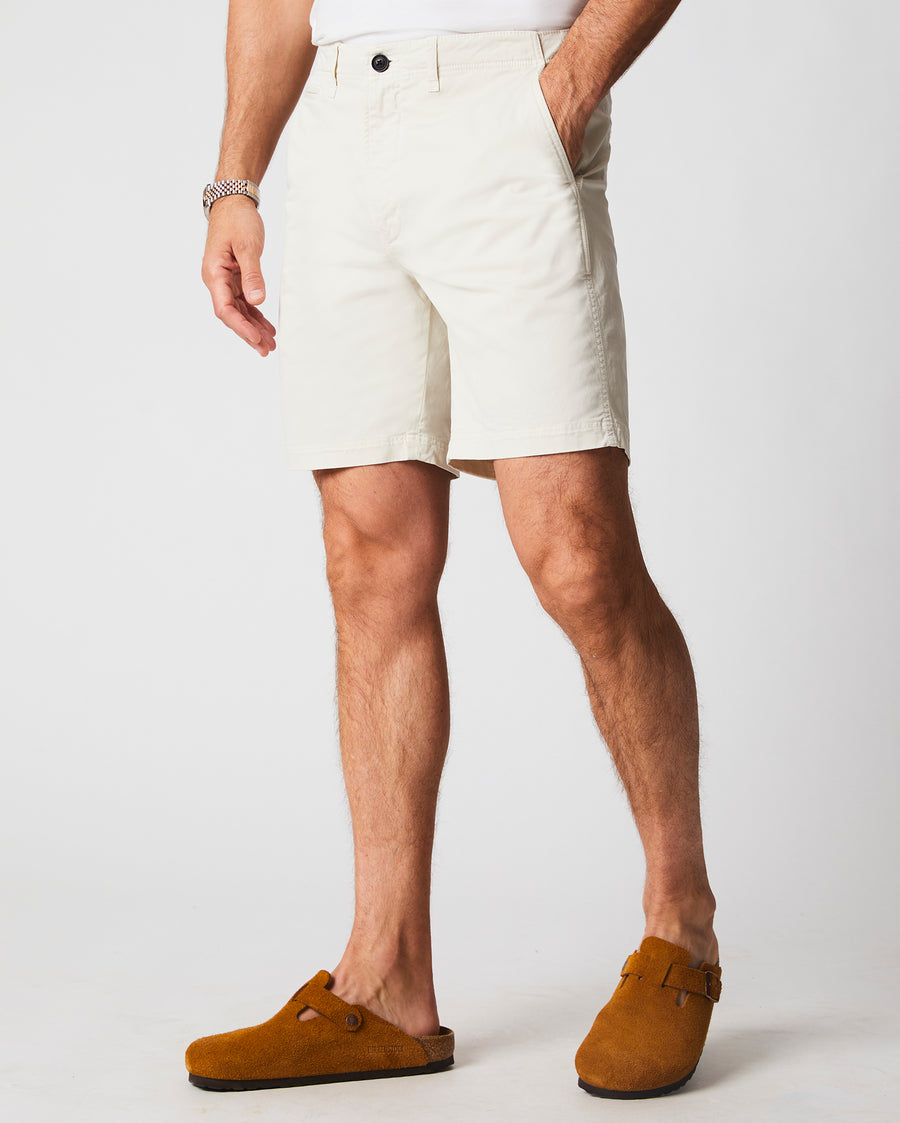 Male model wears the Chino Short in Eggshell