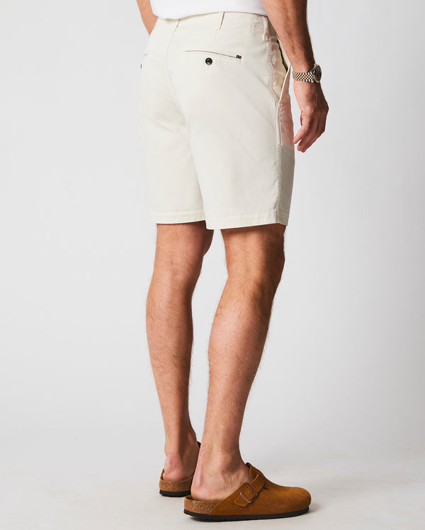 Male model wears the Chino Short in Eggshell