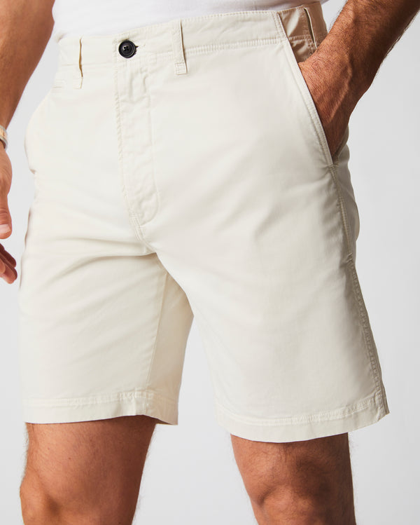 Male model wears the Chino Short in Eggshell